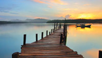 Wooden dock during sunset.